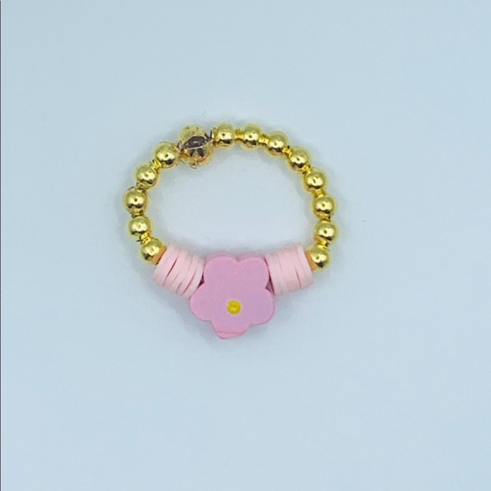Clay bead ring with wooden flower charm